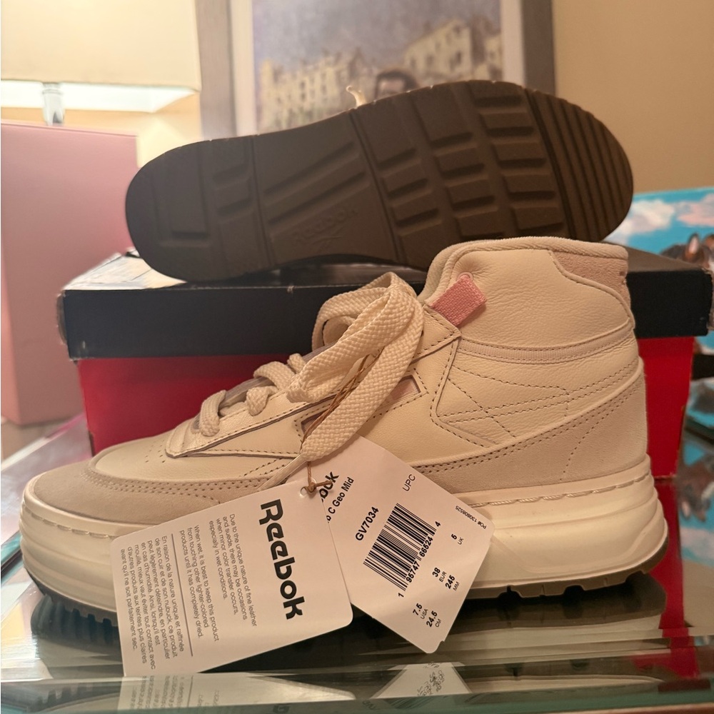 Reebok Women’s Club C cream leather hightops, never worn, brand new with tags.